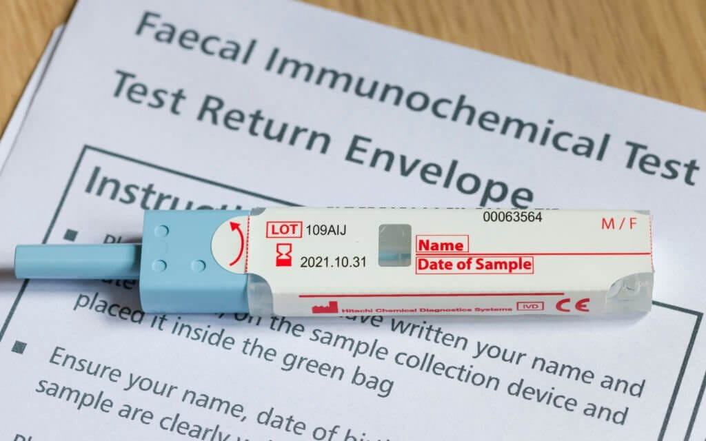 Closeup of FIT test (faecal immunochemical test), a fecal occult blood test for screening bowel cancer